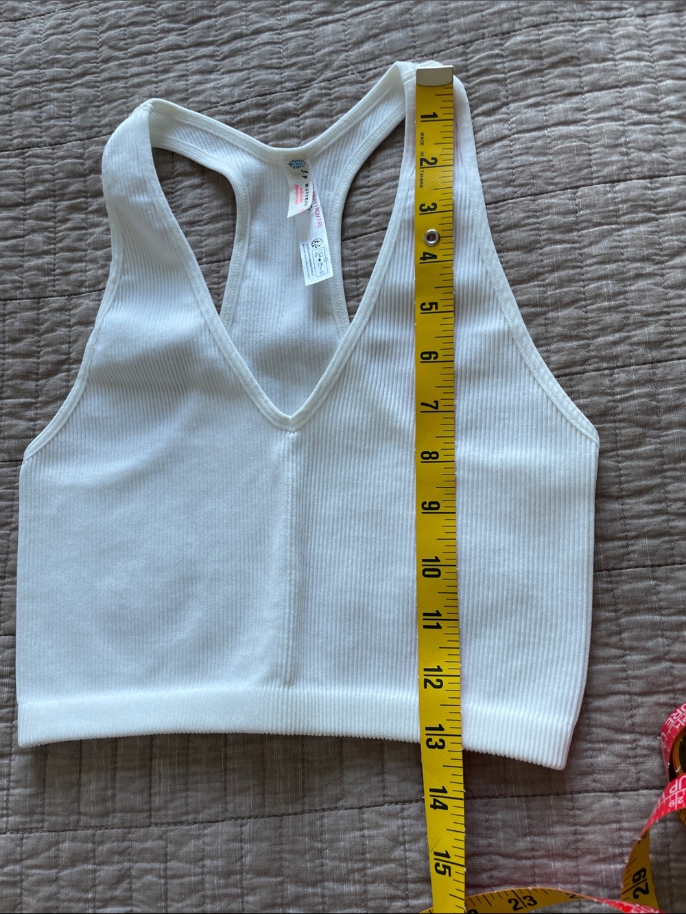 FP Movement by Free People White Ribbed Racerback Tank stretching - Picture 5 of 5